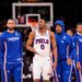 Philadelphia 76ers guard Tyrese Maxey (0) reacts and is assisted after being injured against the Atlanta Hawks during the second half at State Farm Arena.