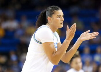 Lauren Betts clapping during a basketball game.
