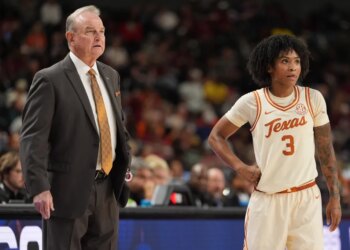 Texas Longhorns head coach Vic Schaefer and guard Rori Harmon (3) on the court.