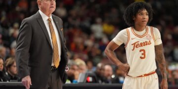 Texas Longhorns head coach Vic Schaefer and guard Rori Harmon (3) on the court.