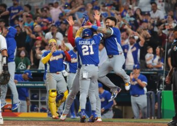 Ronald Acuña Jr. (21) and Gleyber Torres (25) react after Acuña scores in a World Baseball Classic semifinal game.