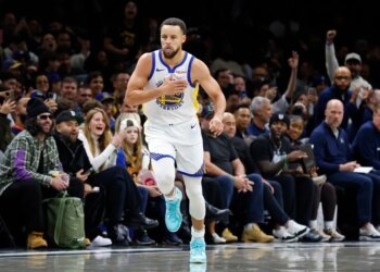 Stephen Curry of the Golden State Warriors reacts after scoring during the second half of a game.