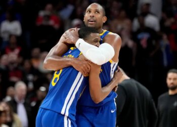 Warriors players De'Anthony Melton and Al Horford