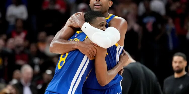 Warriors players De'Anthony Melton and Al Horford