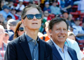 Red Sox owners John Henry and Tom Werner at a baseball game.