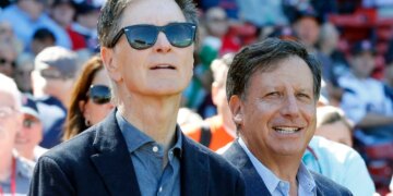 Red Sox owners John Henry and Tom Werner at a baseball game.