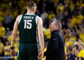 Michigan State head coach Tom Izzo talks to center Carson Cooper during a game.
