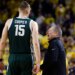 Michigan State head coach Tom Izzo talks to center Carson Cooper during a game.