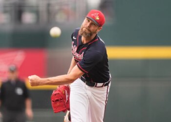 Atlanta Braves pitcher Chris Sale mid-pitch.