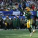 A Green Bay Packers player throws a football at MetLife Stadium.