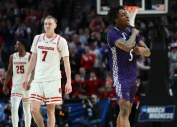 High Point forward Braden Hausen, right, and Wisconsin guard Andrew Rohde (7) react during the second half in the first round of the NCAA college basketball tournament Thursday, March 19, 2026, in Portland, Ore.