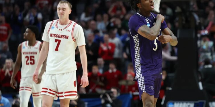 High Point forward Braden Hausen, right, and Wisconsin guard Andrew Rohde (7) react during the second half in the first round of the NCAA college basketball tournament Thursday, March 19, 2026, in Portland, Ore.