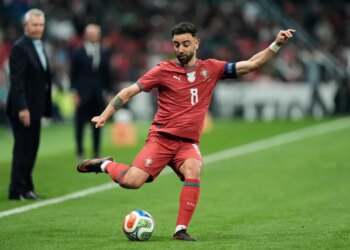 Portugal's Bruno Fernandes passing the ball during a soccer match.