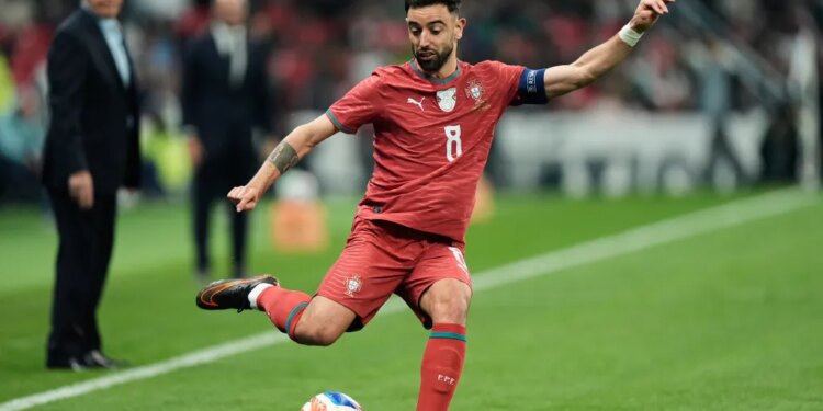 Portugal's Bruno Fernandes passing the ball during a soccer match.