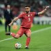 Portugal's Bruno Fernandes passing the ball during a soccer match.
