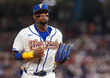 Ronald Acuna Jr. of Venezuela returning to the dugout during a baseball game.