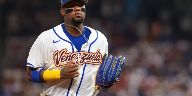 Ronald Acuna Jr. of Venezuela returning to the dugout during a baseball game.