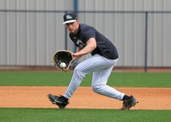 New York Yankees first baseman Ben Rice fielding a ball during practice at Steinbrenner Field.