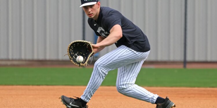 New York Yankees first baseman Ben Rice fielding a ball during practice at Steinbrenner Field.