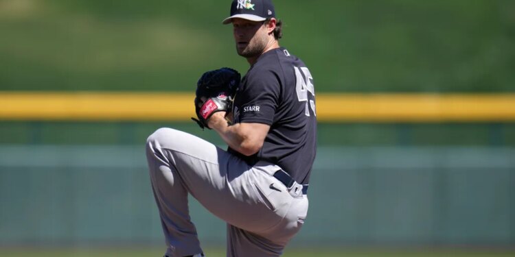 New York Yankees starting pitcher Gerrit Cole warms up during the first inning of a spring training baseball game against the Chicago Cubs, Tuesday, March 24, 2026, in Mesa, Ariz.