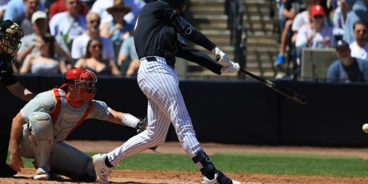 New York Yankees infielder Ryan McMahon hits an RBI single against the Philadelphia Phillies.