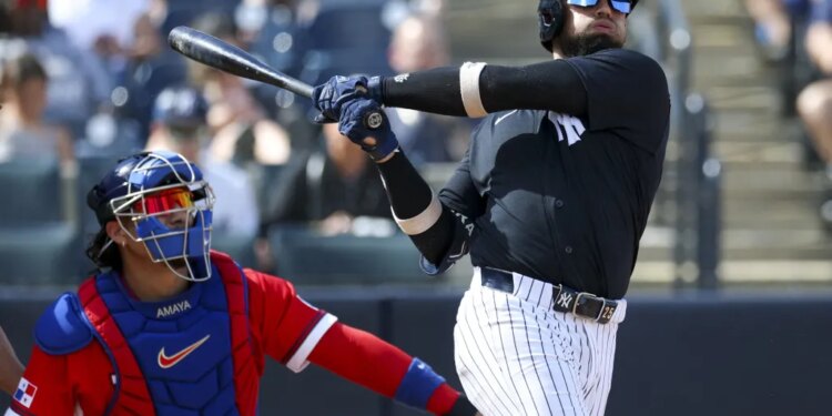 J.C. Escarra belts a two run homer in the fifth inning of the Yankees' 11-1 exhibition win over Panama at George M. Steinbrenner Field on March 3, 2026.