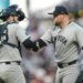 Austin Wells (left) celebrates with closer David Bednar after the Yankees' 3-1 win over the Giants at Oracle Park on March 28, 2026 in San Francisco.