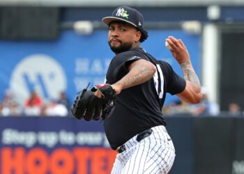 Luis Gil pitching during spring training.