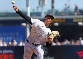 New York Yankees pitcher Carlos Lagrange #84, throwing a warmup pitch before the start of the 2nd inning.