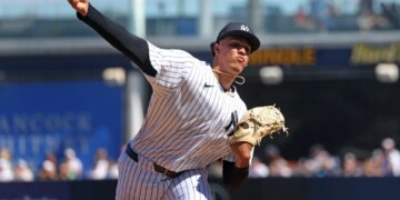New York Yankees pitcher Carlos Lagrange #84, throwing a warmup pitch before the start of the 2nd inning.