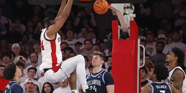Zuby Ejiofor, who had a triple double, slams home a dunk during St. John's 89-57 blowout win over Villanova at the Garden on Feb. 28, 2026.