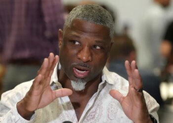 Aaron Glenn speaking to reporters at the NFL annual league meetings.