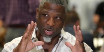 Aaron Glenn speaking to reporters at the NFL annual league meetings.