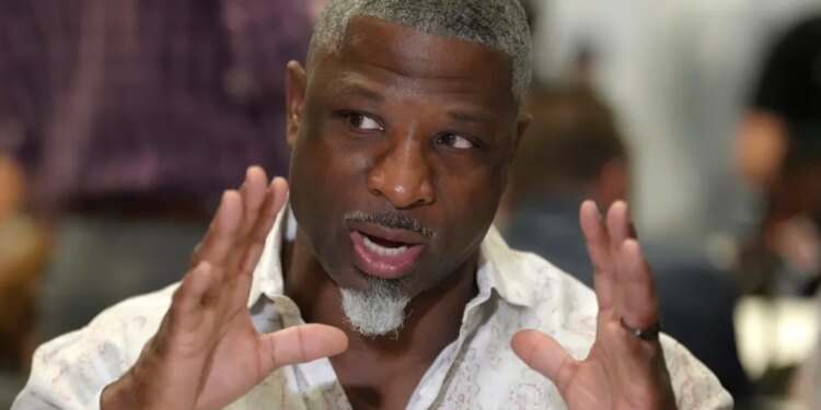 Aaron Glenn speaking to reporters at the NFL annual league meetings.