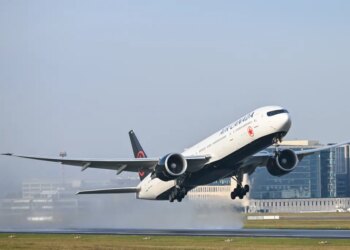 An Air Canada Boeing 777 passenger jet taking off from Brussels Airport.