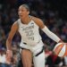 Las Vegas Aces center A'ja Wilson (22) dribbles against the Phoenix Mercury during the first half of Game 4 of the WNBA basketball finals, Friday, Oct. 10, 2025, in Phoenix.