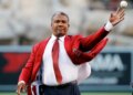 Former Los Angeles Angels outfielder Garret Anderson throws the ceremonial first pitch.