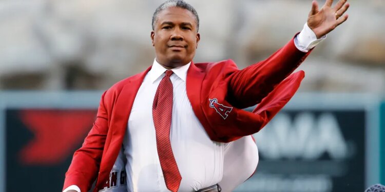 Former Los Angeles Angels outfielder Garret Anderson throws the ceremonial first pitch.