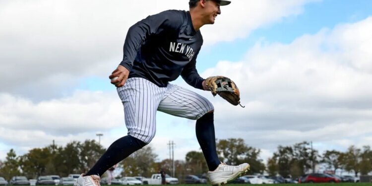 New York Yankees shortstop Anthony Volpe #11, fielding a ball during todays workout at Steinbrenner Field, the Yankees Spring Training home in Tampa, Florida.
