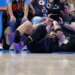 Luka Doncic lying on the court after falling during a play.