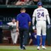 Texas Rangers' Brandon Nimmo (24) walks off the field with head athletic trainer Matt Lucero after suffering an unknon injury in the fifth inning of a baseball game against the Texas Rangers Wednesday, April 29, 2026, in Arlington, Texas.
