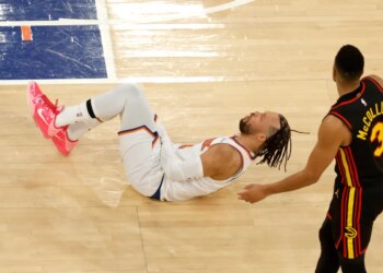 Jalen Brunson (11) reacts after Atlanta Hawks guard CJ McCollum (3) puts up a shot a kicks New York Knicks guard Jalen Brunson (11) groin during the third quarter.