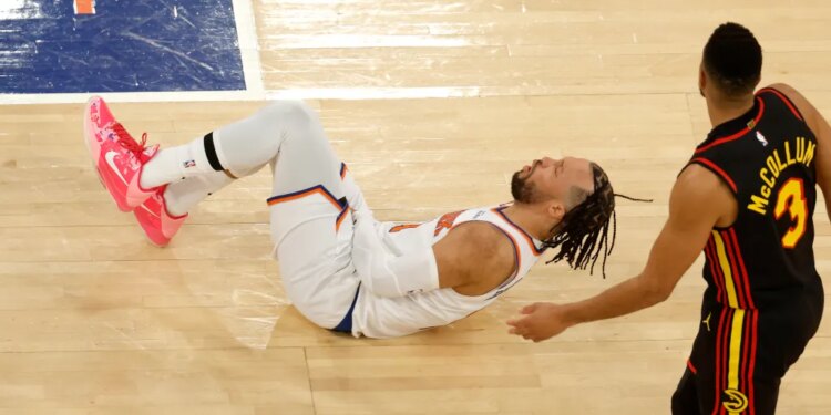 Jalen Brunson (11) reacts after Atlanta Hawks guard CJ McCollum (3) puts up a shot a kicks New York Knicks guard Jalen Brunson (11) groin during the third quarter.