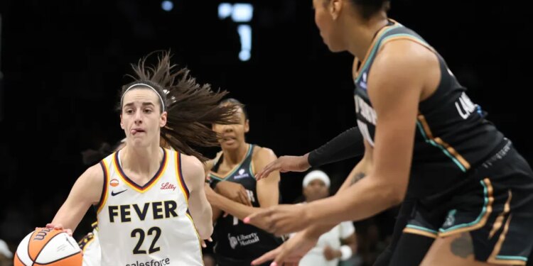 Caitlin Clark looks to make a move between defenders during the Liberty's 109-91 preseason loss to the Fever on April 25, 20267 at Barclays Center.