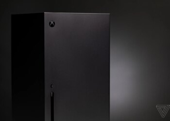 The Xbox Series X in front of a black background.