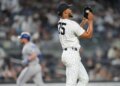 New York Yankees pitcher Camilo Doval (75) reacts as Kansas City Royals' Vinnie Pasquantino runs the bases after hitting a home run during the eighth inning of a baseball game Friday, April 17, 2026, in New York.