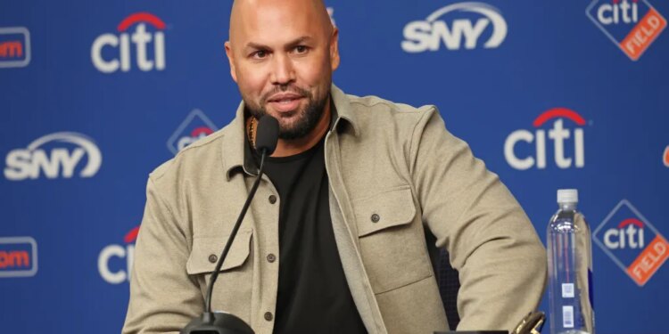 Carlos Beltran speaks at a press conference.