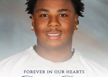 A tribute image for Ryder Barnes, featuring his smiling portrait and the text "FOREVER IN OUR HEARTS Ryder Barnes" and a Bible verse.