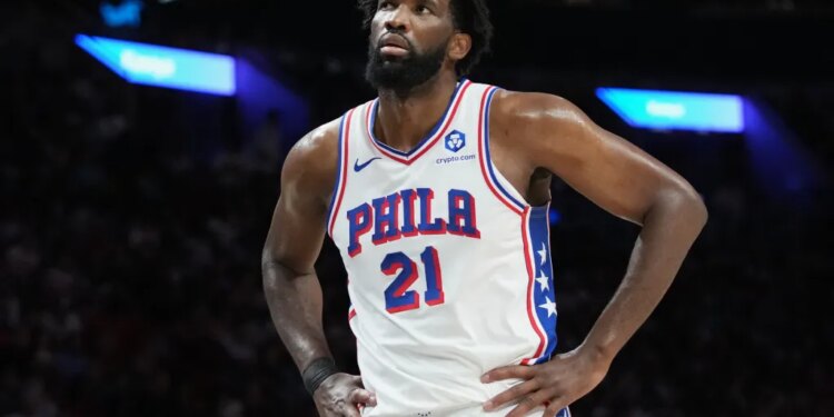 Philadelphia 76ers center Joel Embiid (21) reacts during the second half of an NBA basketball game against the Miami Heat, Monday, March 30, 2026, in Miami.