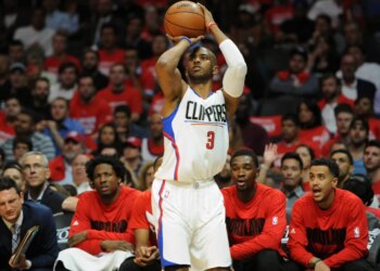 Los Angeles Clippers guard Chris Paul shooting a three-point basket during a basketball game.